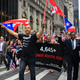 Nuyoricans taking advantage of the Puerto Rican Day Parade to highlight estimates on the death toll from Hurricane Maria.